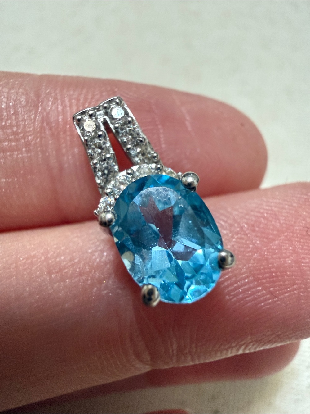 Sterling Silver 925 Blue Topaz Oval Pendant with Cubic Zirconia Accents